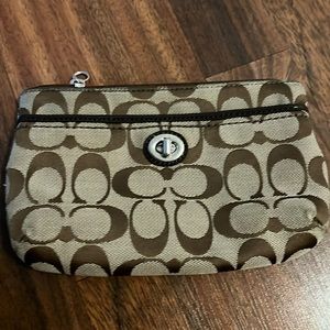 290. Coach pouch